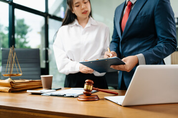 business people and lawyers discussing contract papers sitting at the table. Concepts of law,...