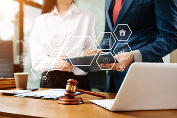 Professional lawyers signing a business contract with digital legal icons, justice, security, and...