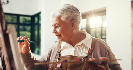 Elderly woman, creative and artist painting for craft, talent and art with sketch in home....