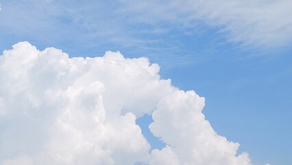 White clouds scattered across the blue sky with daylight natural background. Blue sky with clouds....