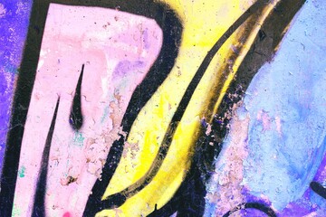 Bold abstract graffiti in pastel pink, yellow, blue tones. Urban 90s style, vibrant texture, artistic decay. Art installations, backgrounds, street visuals, modern 2000s aesthetics.