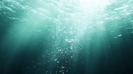 Underwater Sunlight Filtering Through Water with Rising Bubbles and Turquoise Hue