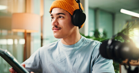 Thinking, tablet and man in studio for podcast, broadcast and talk show at media agency. Radio...
