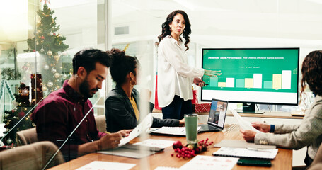 Christmas, presentation or review with business people in boardroom for December sales performance. Computer screen, documents or meeting with employee team in office for xmas charts or graphs update