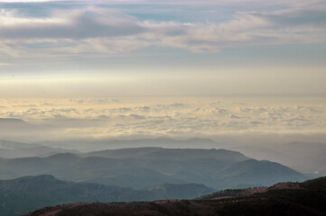 view of the clouds from the top of the mountain