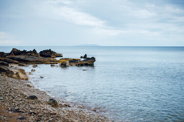 Serene Rocky Beach with Calm Waves