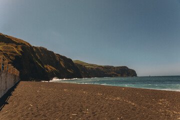 Black Sand Beach & Blue Waters