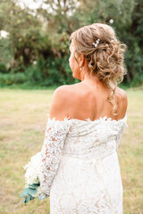 Bride in Lace Dress with Bouquet, Back View in Punta Gorda, Flor