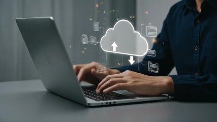 Person uploading and downloading data to the cloud on a laptop for digital connectivity - Powered by Adobe