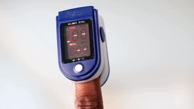 Cardiology Patient With Oximeter Checking Pulse