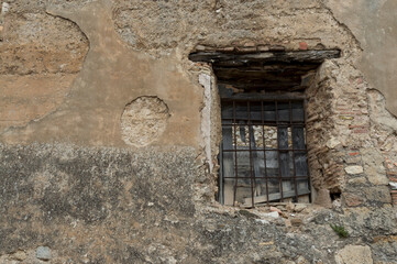 old window of a rural house with its original lattice