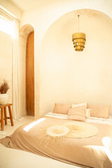 Soft neutral tones create a calming atmosphere in this sunny bedroom