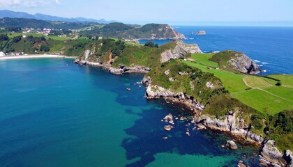 Coastal landscape with lush green hills and turquoise water
