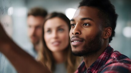 A diverse team brainstorms a marketing strategy around a whiteboard in a modern office  long title A diverse group of professionals collaboratively