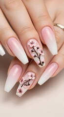 Exquisite Coffin Nails with Delicate 3D Cherry Blossom Art, Featuring a Soft Pink and White Ombre Gradient Design for a Touch of Elegance and Springtime Beauty
