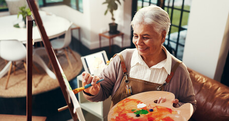 Senior woman, painting and artwork in home with smile, above and canvas for inspiration in...