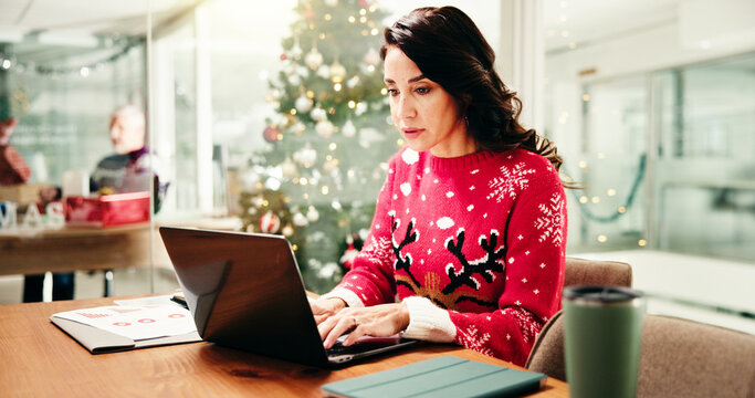 Christmas, office and business woman on computer for finance report, proposal and profit for holiday season. December, corporate and person on laptop for payroll, financial review and budget - Powered by Adobe