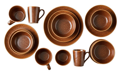 Overhead view of brown speckled stoneware plates bowls and mugs on dark surface