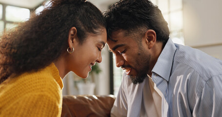 Love, forehead and smile with couple on sofa for romantic connection, support and trust. Marriage, commitment and relationship partner with man and woman in living room of home for care and loyalty