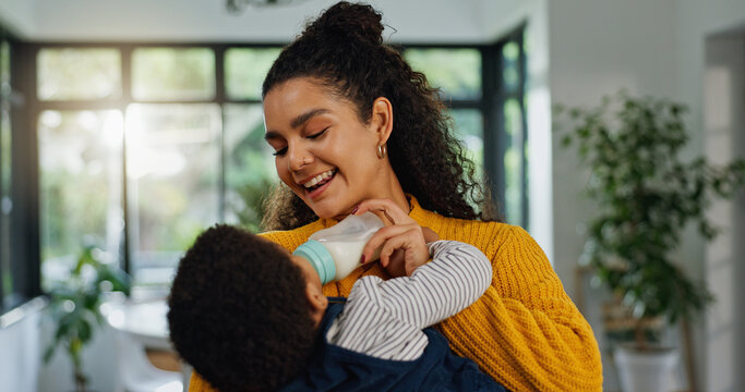 Home, mother and baby with bottle, smile and bonding together with nap time, wellness and care. Apartment, parent and mama with infant, child development and feeding with nutrition, growth and love