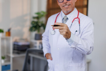 healthcare, Mala doctor character holds clipboard and standing in workplace.Professional...