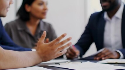 Multicultural business team brainstorming during a meeting in a modern office - Powered by Adobe