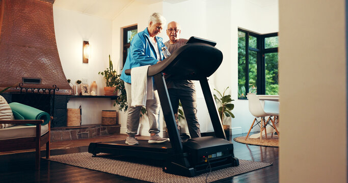 Elderly couple, treadmill and help for fitness in home, walk and support with training in retirement. Senior man, woman and discussion with gym equipment, machine and steps with exercise in house - Powered by Adobe