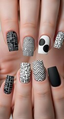 Creative Matte Black and White Geometric Nail Art with Abstract Patterns and Polka Dots, Showcasing Modern Manicure Designs