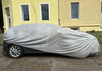 Covered car on the city street