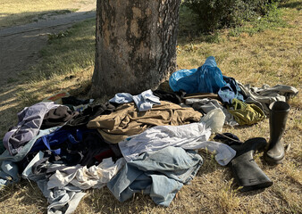 Old clothes next to a tree outdoor