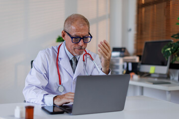 Portrait of sad male doctor upset tired medical worker closing head with hands. Depressed male...