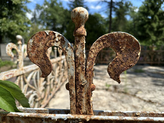 Part of an old rusty metal ornament in the cemetery