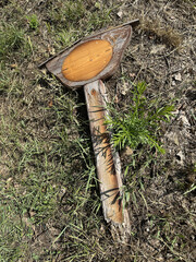 Broken wooden tombstone in the cemetery