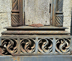 Part of an old metal ornament in the public cemetery