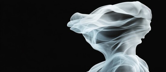Fototapeta premium Ethereal figure shrouded in white fabric against a dark background