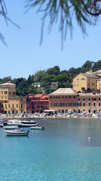 View from rock on sea, Bay of Silence, fishing cove of the town of Sestri-Levante, Italy. Tourism and recreation. Ecologically clean nature. Traditional old buildings. Historical center.