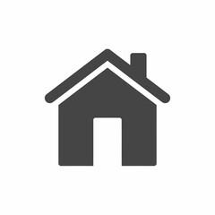 Simple dark gray house icon with a chimney and a white door, isolated on a white background.