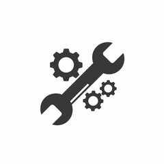 A wrench tool is shown diagonally with two gears, one large and one small, on a white background.