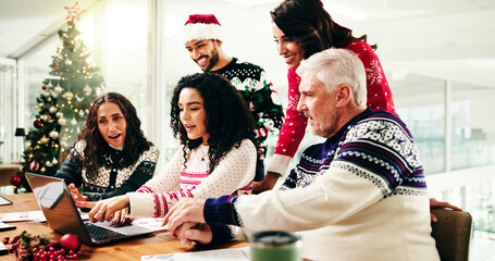 Christmas, laptop and business people in meeting for discussion, brainstorming or finance analysis....