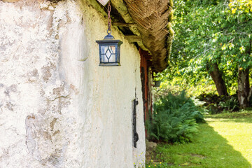 Idyllic old barn with an old lantern hanging on a chain © Lars Johansson
