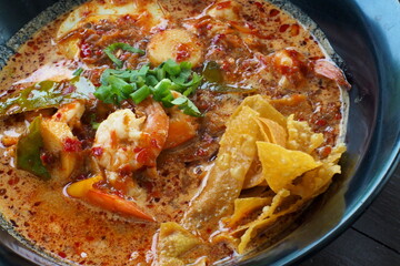 Golden Crispy Wontons Elevate Zesty Tom Yum Soup