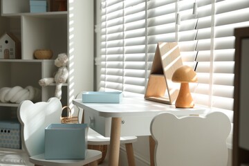 Stylish playroom with decor and furniture. Interior design