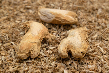 Whole and crushed dried ginger root, a versatile spice for cooking and health.