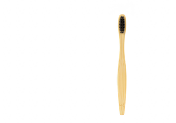 A natural bamboo toothbrush with black bristles, isolated on a transparent background