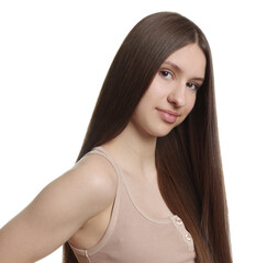 Portrait of beautiful teenage girl with healthy long hair on white background