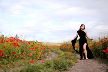 Smiling woman running in beautiful wildflower meadow
