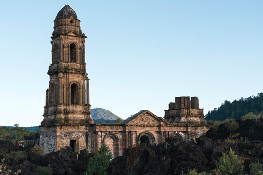 Facade of San Juan de Paricutin Church buried into volcanic rock field