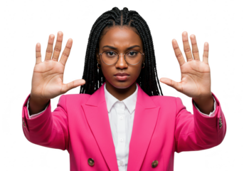 A serious woman with braids and glasses wearing a pink blazer holds up her hands in a stop gesture, isolated on a transparent background
