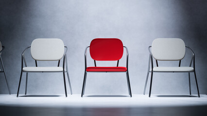 Red chair standing out from the crowd of white chairs