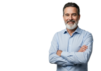 A middle-aged caucasian man (45-55) with short dark hair, grey temples, and a trimmed grey-white beard, wearing a light blue button-up shirt, arms crossed, smiling confidently at camera against a